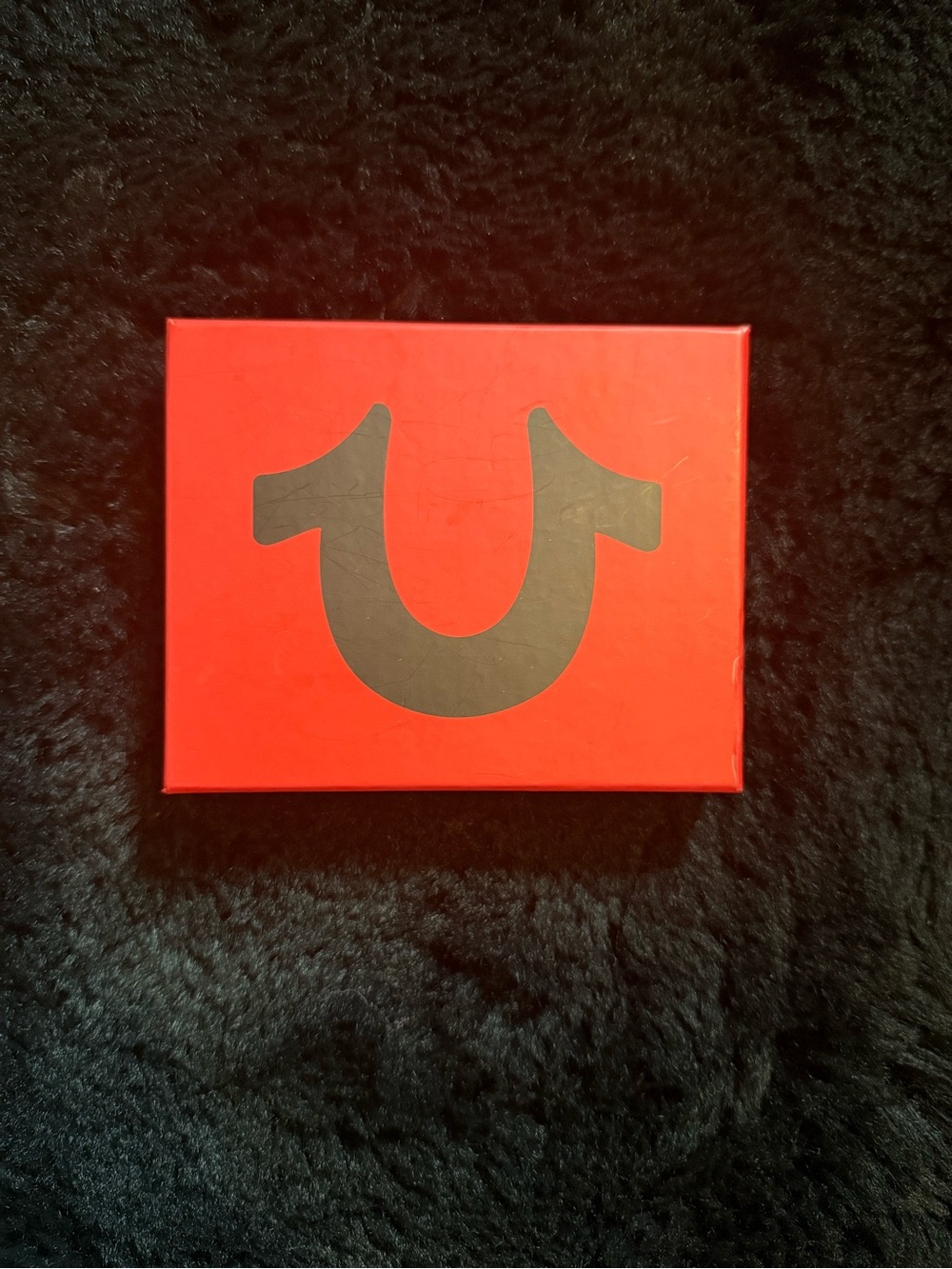 True Religion Red Box with Black Horseshoe Emblem